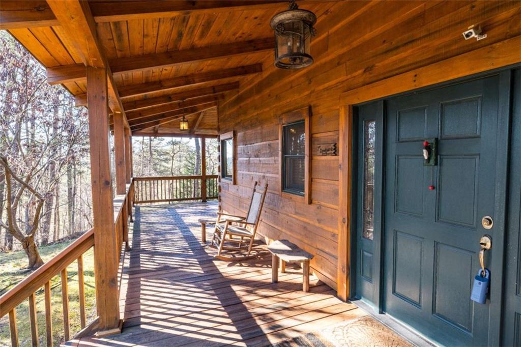 2077 Big Texas Valley Road Northwest Rome, GA 30165 - Photo 2 of 42 a sitting area with furniture and wooden deck
