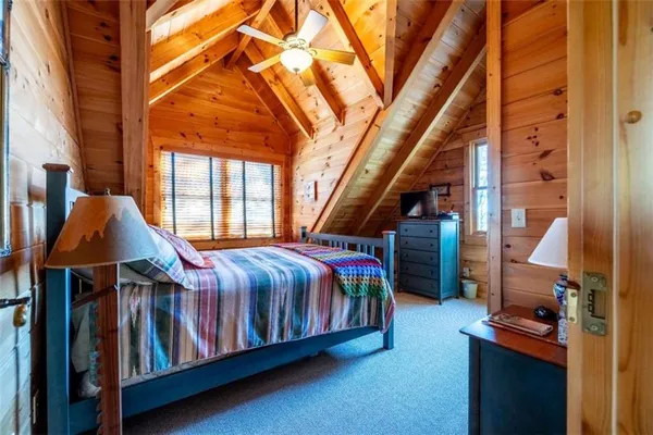 a bedroom with furniture and a window