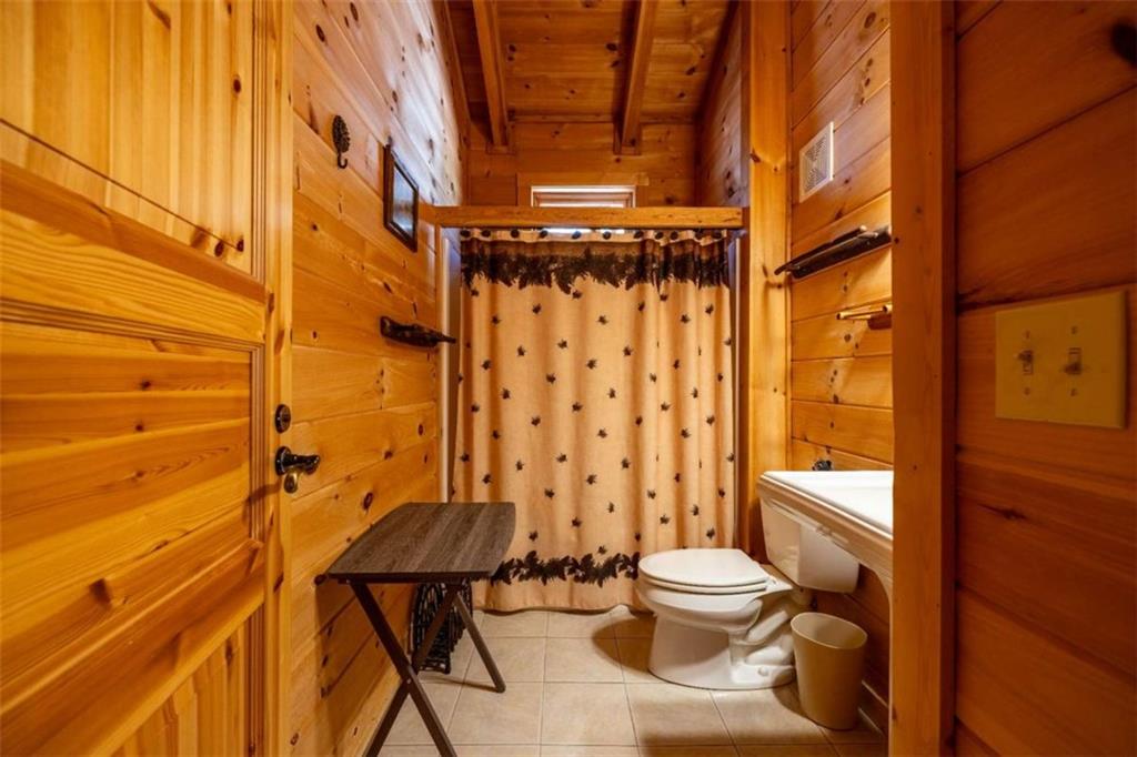 2077 Big Texas Valley Road Northwest Rome, GA 30165 - Photo 24 of 42 a bathroom with a toilet and shower