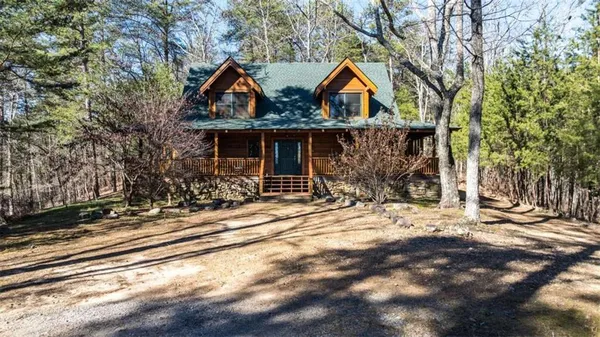 a view of house with wooden fence