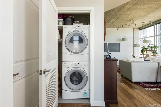 a view of a hallway with washer and dryer