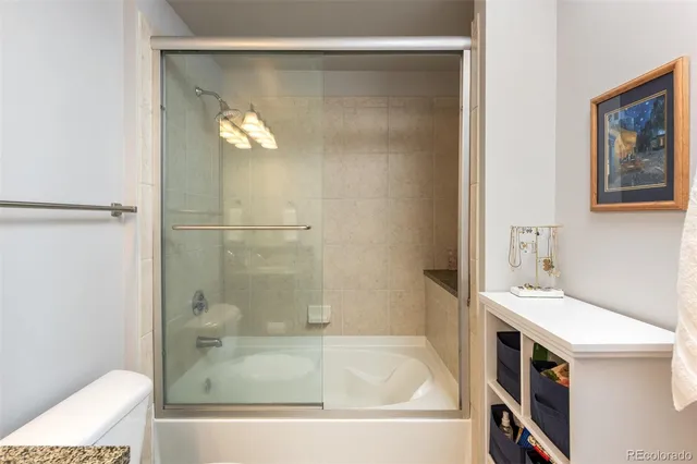 a bathroom with a tub and a sink