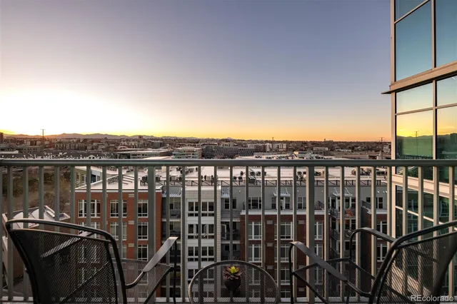 a view of a balcony with city
