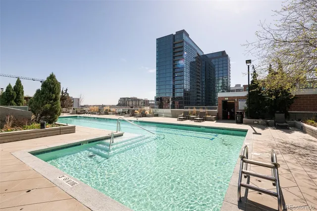 a view of a patio with dining table and chairs