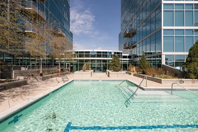 a kitchen with stainless steel appliances kitchen island wooden cabinets and fireplace