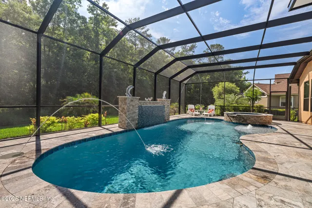 an aerial view of residential house with outdoor space and lake view