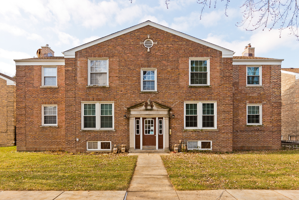 4246 West Nelson Street, Unit 2 Chicago, IL 60641 - Photo 1 of 12 a front view of a house with a yard