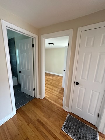 4246 West Nelson Street, Unit 2 Chicago, IL 60641 - Photo 6 of 12 a view of a hallway with wooden floor and staircase