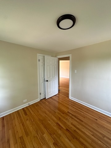4246 West Nelson Street, Unit 2 Chicago, IL 60641 - Photo 8 of 12 a view of room with wooden floor