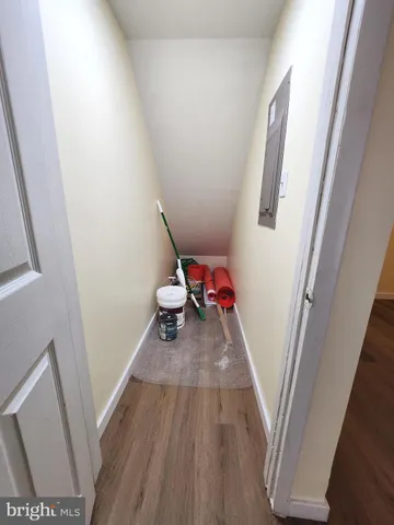 a view of a room with wooden floor and staircase