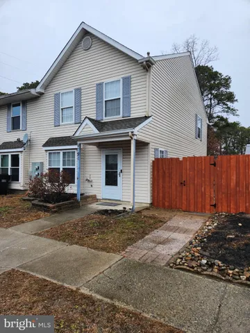 a front view of a house with a garage