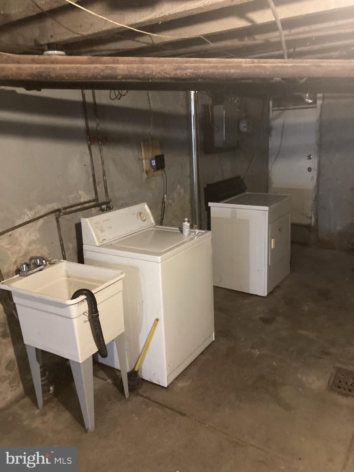 3145 North Patton Street Philadelphia, PA 19132 - Photo 16 of 16 a utility room with dryer and washer