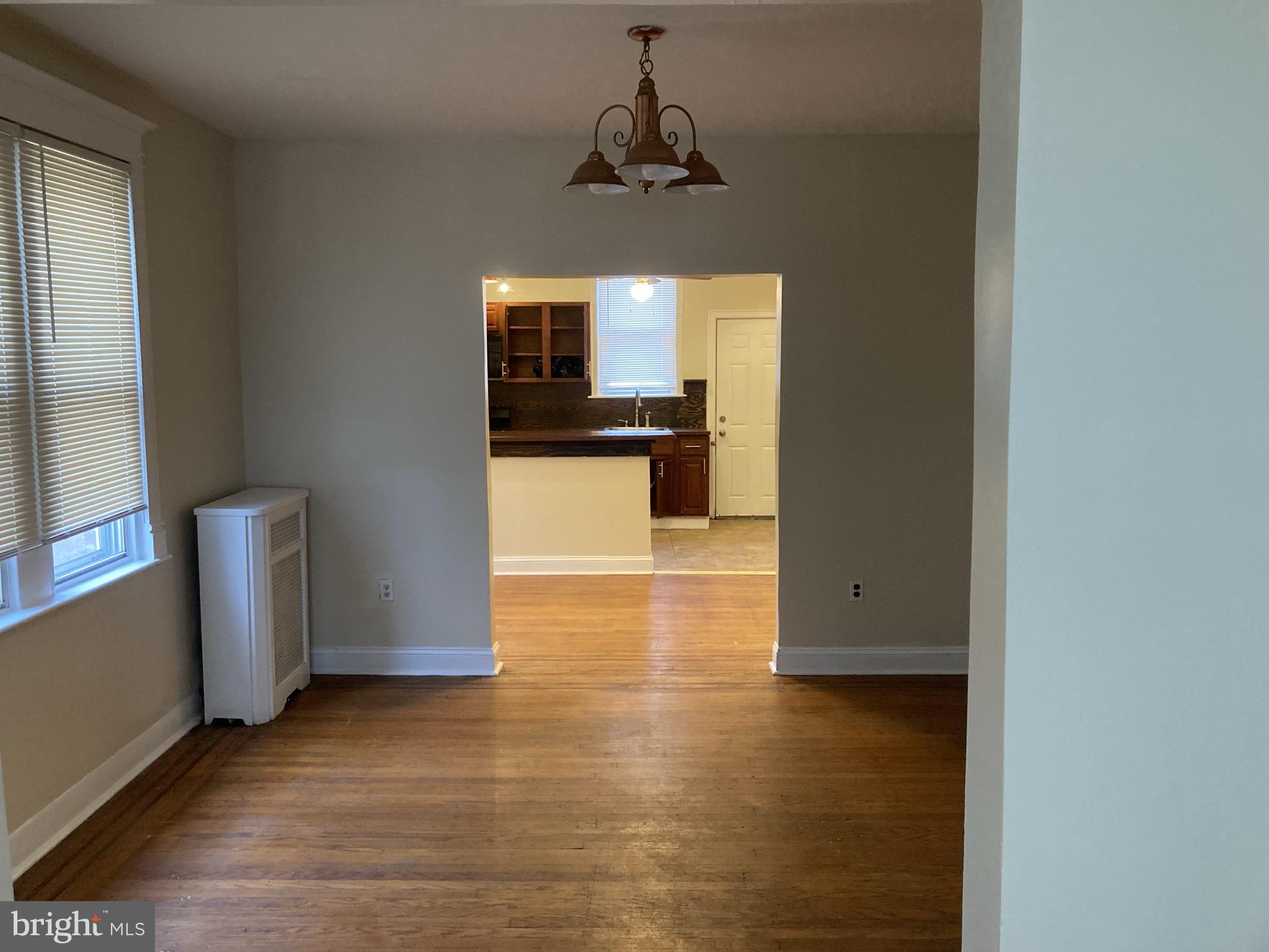 3145 North Patton Street Philadelphia, PA 19132 - Photo 4 of 16 a view of a kitchen from the hallway