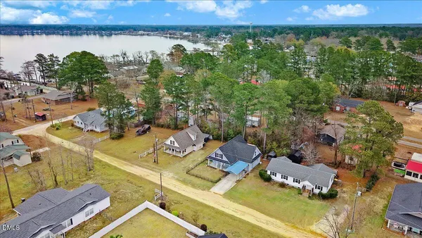 an aerial view of a house with a yard