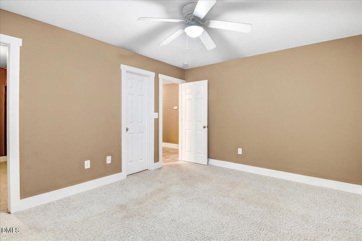 51 Birch Street Elizabethtown, NC 28337 - Photo 19 of 42 an empty room and chandelier fan