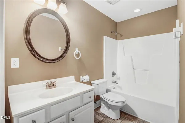 a bathroom with a shower and a bathtub
