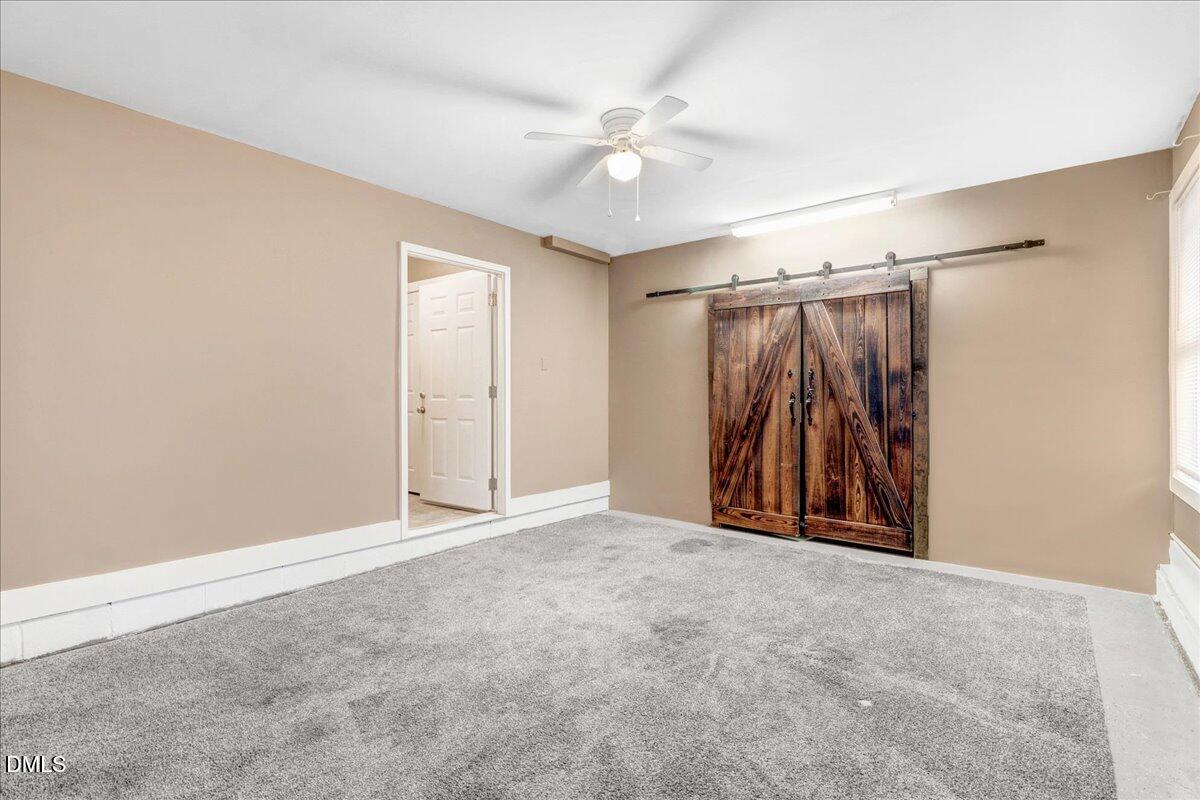 51 Birch Street Elizabethtown, NC 28337 - Photo 25 of 42 an empty room with closet and a ceiling fan