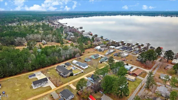 an aerial view of a city with lake view