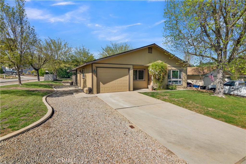 1991 Brook Lane Paso Robles, CA 93446 - Photo 3 of 29 a front view of a house with a yard and garage
