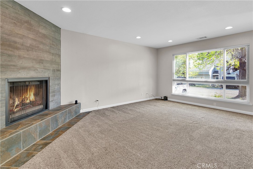 1991 Brook Lane Paso Robles, CA 93446 - Photo 6 of 29 an empty room with windows and fireplace