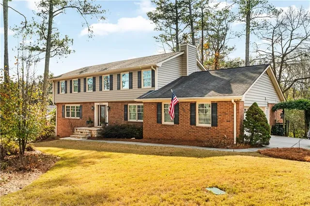 a front view of a house with a yard