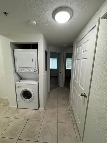 a view of a hallway with washer and dryer