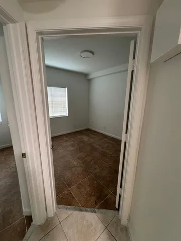 a bathroom with a double vanity sink and mirror