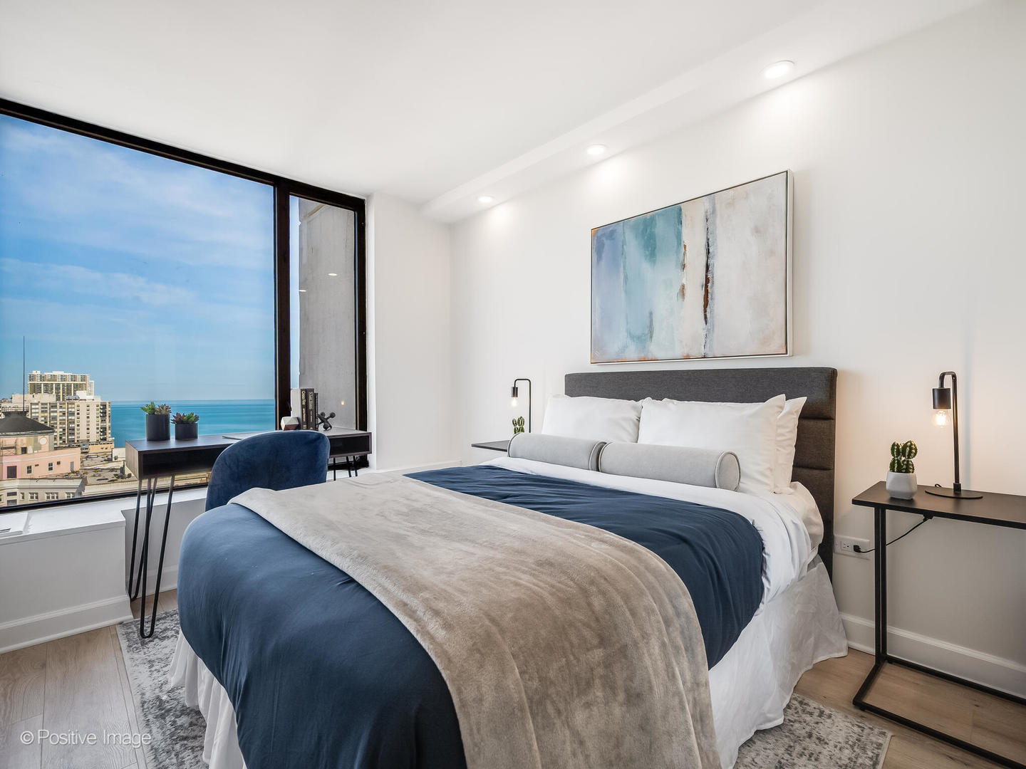 5455 North Sheridan Road, Unit 3203 Chicago, IL 60640 - Photo 11 of 21 a bedroom with a bed and window