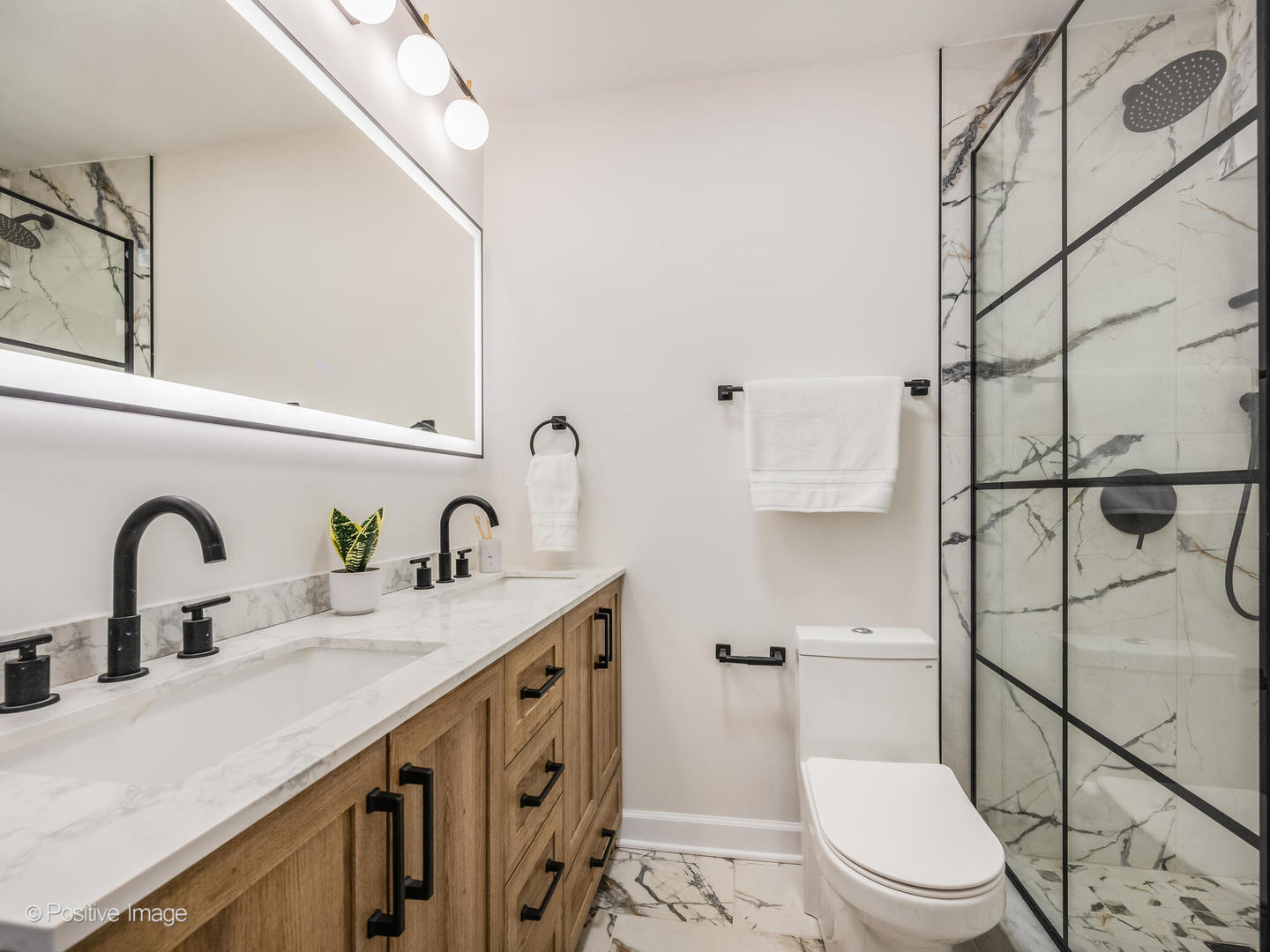 5455 North Sheridan Road, Unit 3203 Chicago, IL 60640 - Photo 13 of 21 a bathroom with a sink a toilet and shower