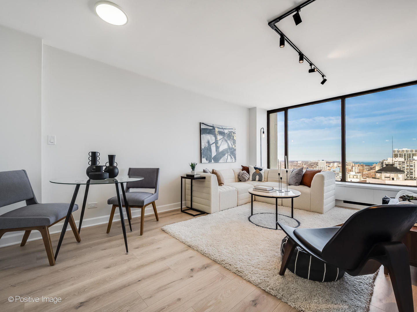 5455 North Sheridan Road, Unit 3203 Chicago, IL 60640 - Photo 2 of 21 a living room with furniture and a window