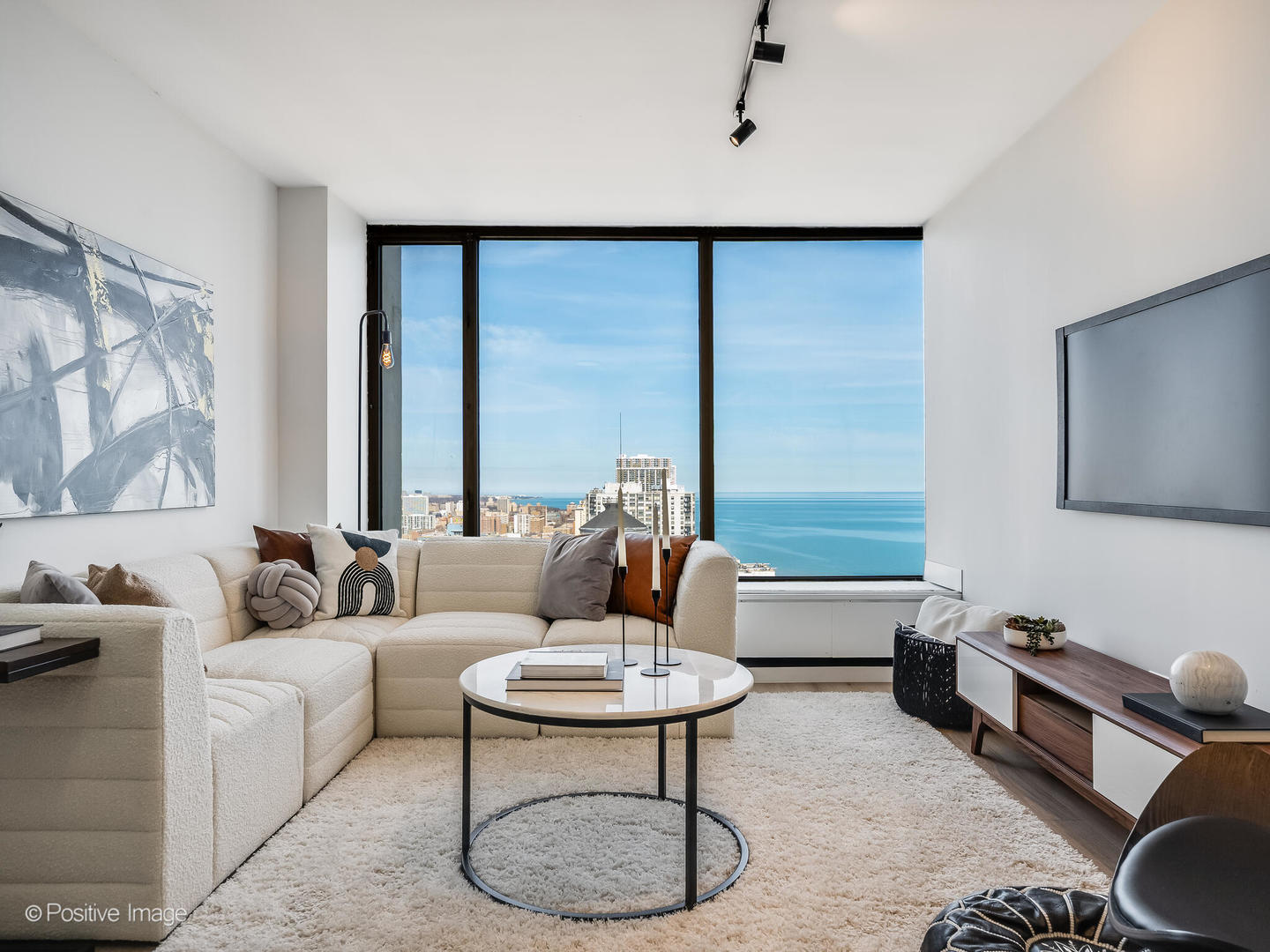 5455 North Sheridan Road, Unit 3203 Chicago, IL 60640 - Photo 4 of 21 a living room with furniture and a large window