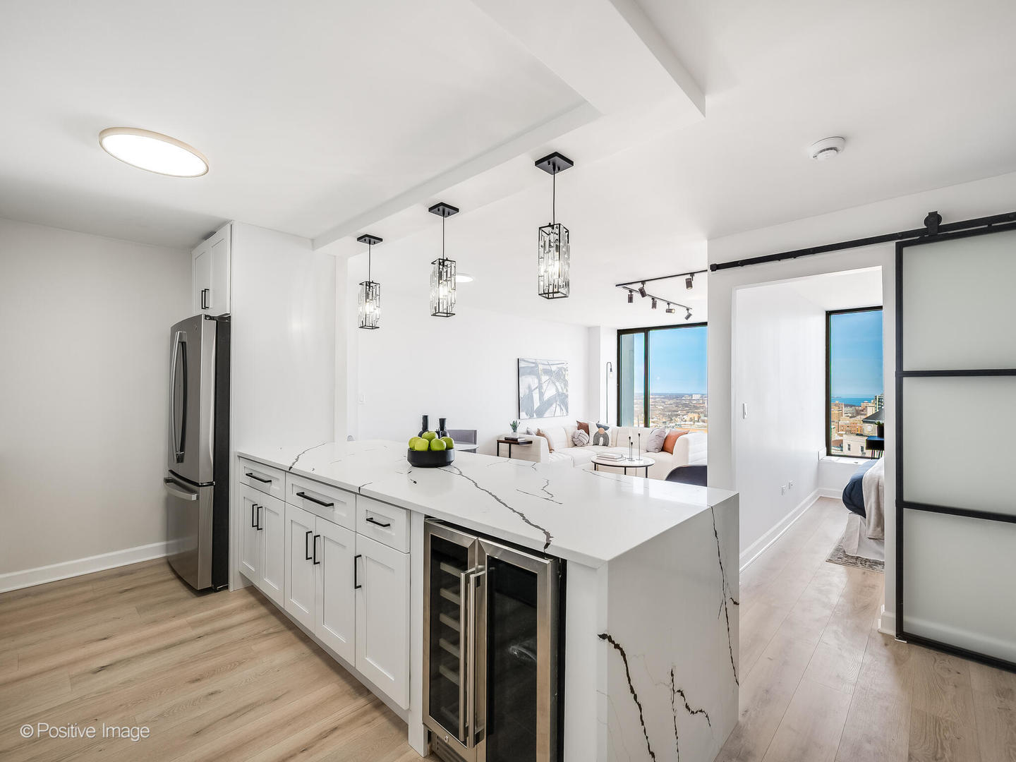 5455 North Sheridan Road, Unit 3203 Chicago, IL 60640 - Photo 9 of 21 a kitchen with stainless steel appliances a sink stove and refrigerator