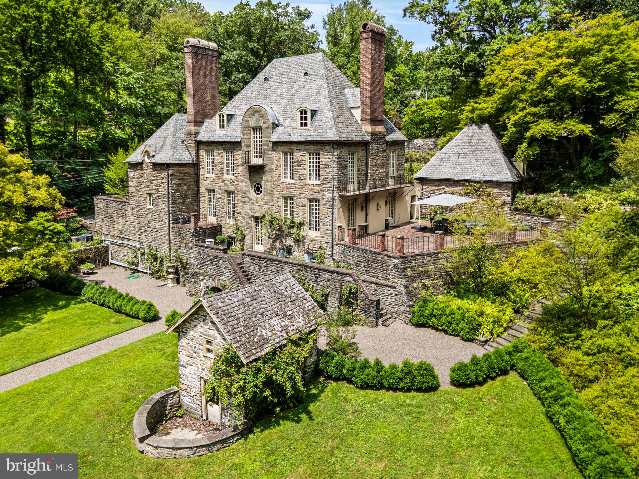 a view of a house with a yard and sitting area