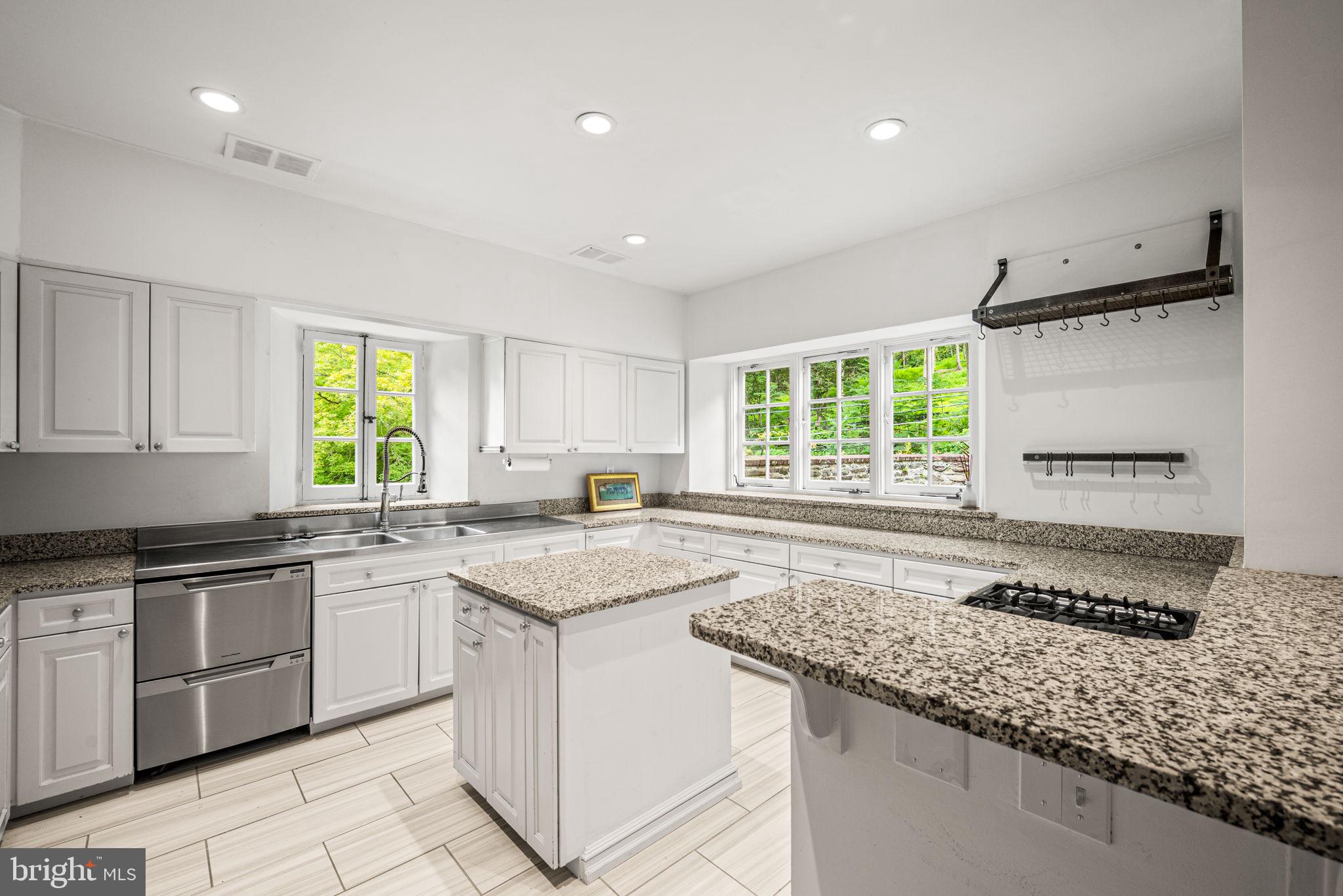 42 West Bells Mill Road Philadelphia, PA 19118 - Photo 12 of 43 a kitchen that has a sink and a window in it