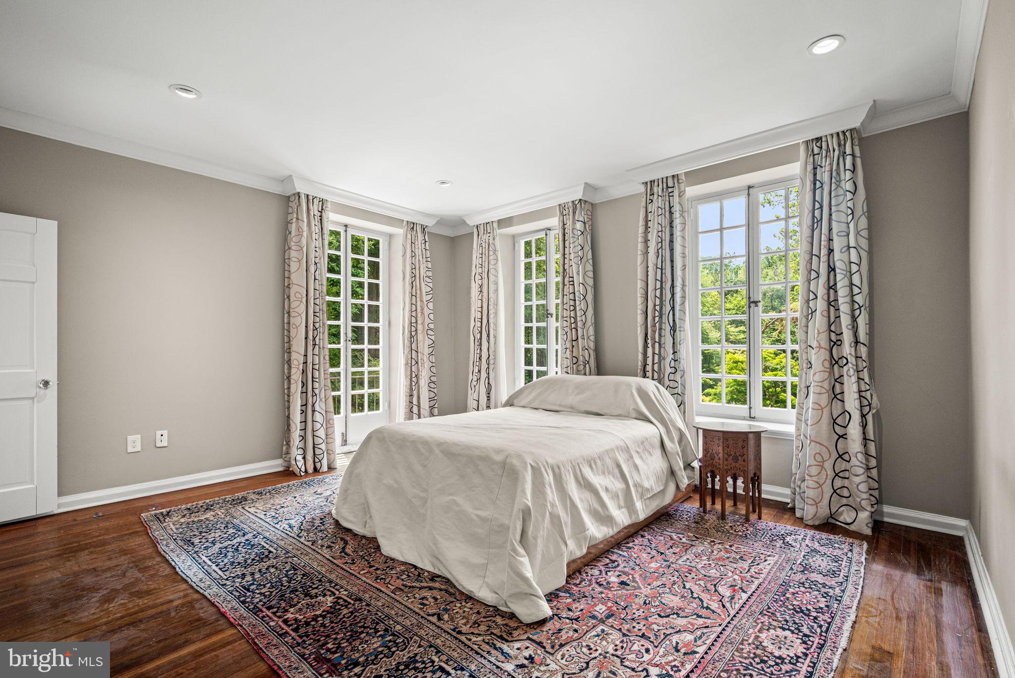 42 West Bells Mill Road Philadelphia, PA 19118 - Photo 17 of 43 a bedroom with a large bed and a window