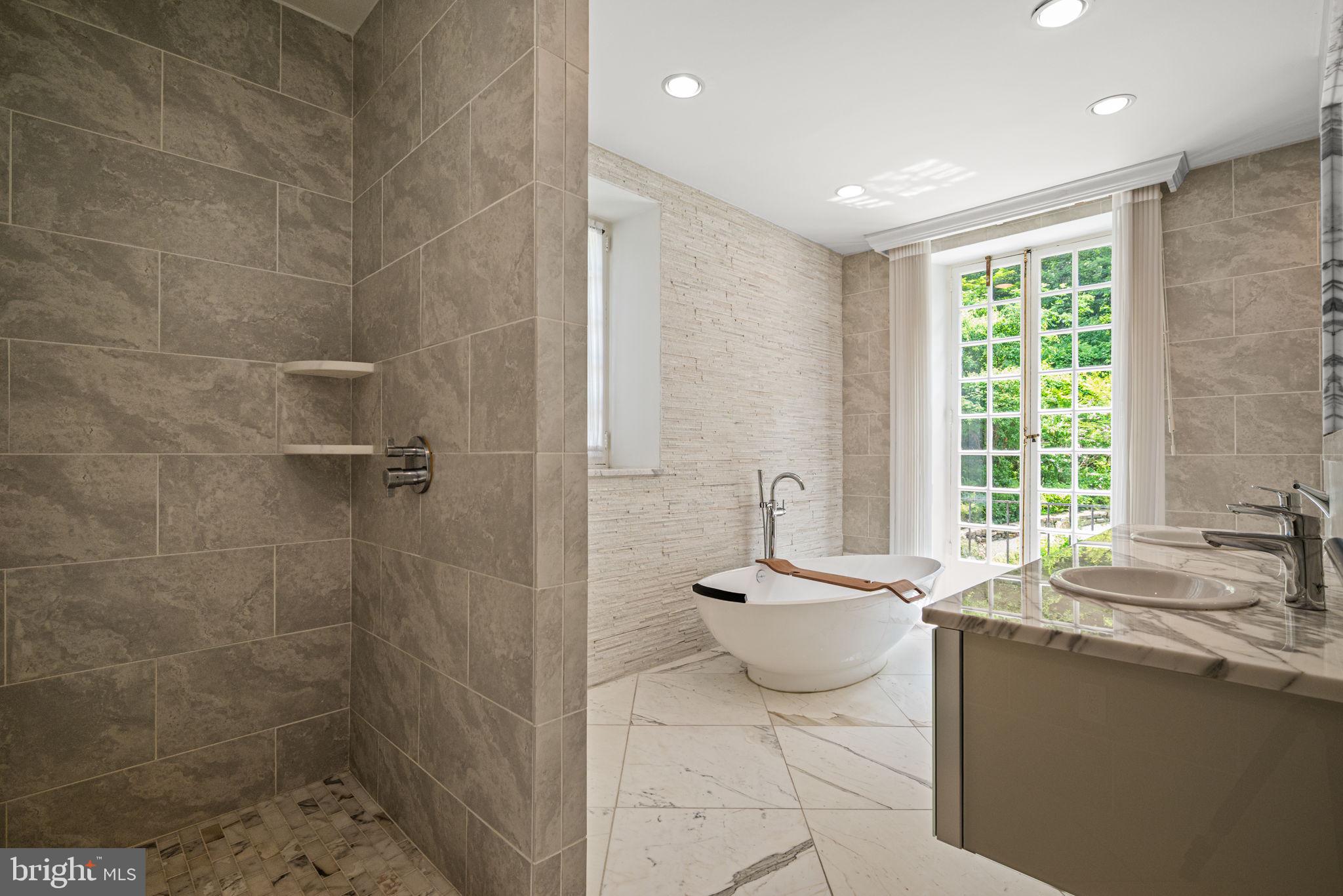 42 West Bells Mill Road Philadelphia, PA 19118 - Photo 19 of 43 a spacious bathroom with sink and mirror