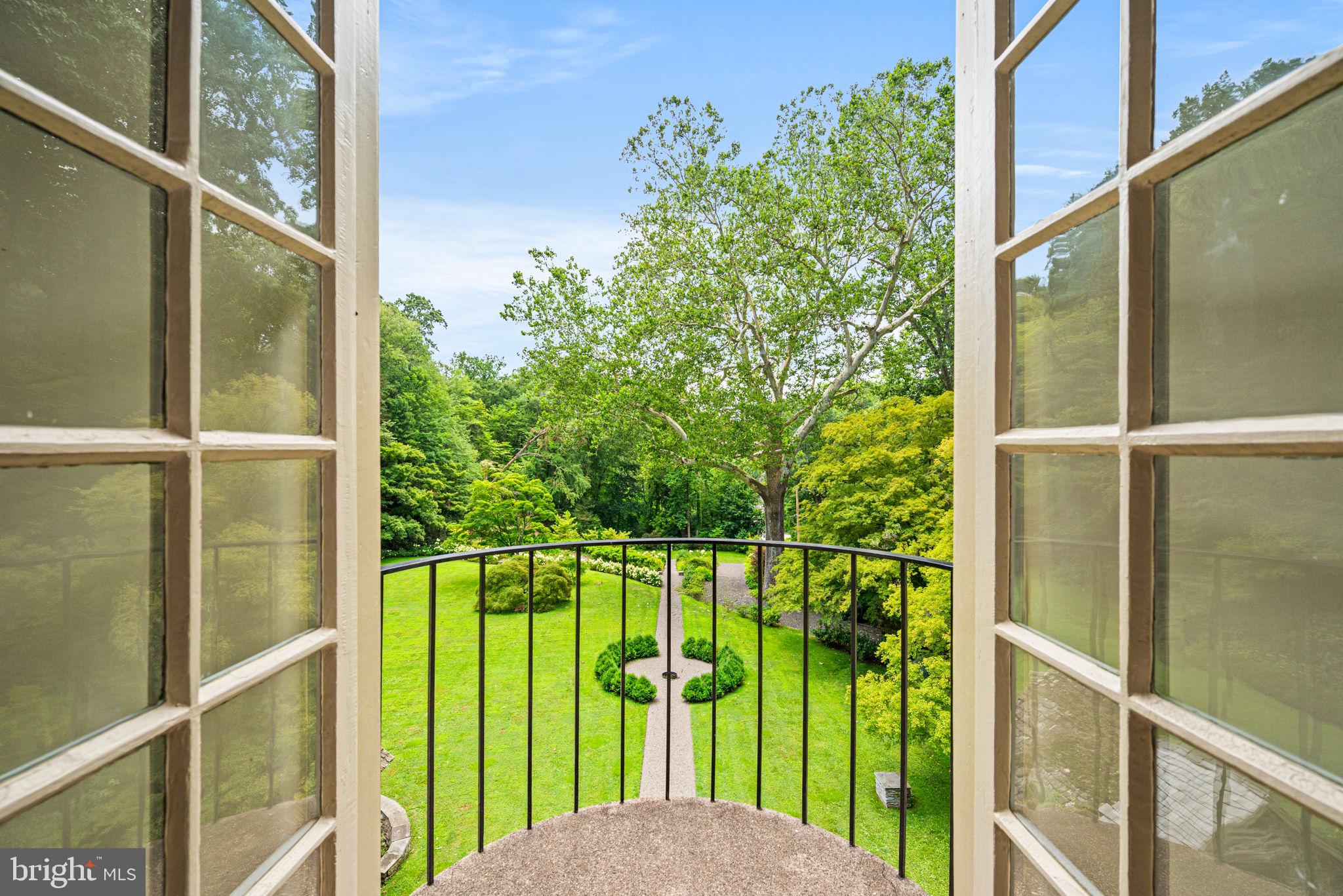 42 West Bells Mill Road Philadelphia, PA 19118 - Photo 21 of 43 a view of a garden from a window