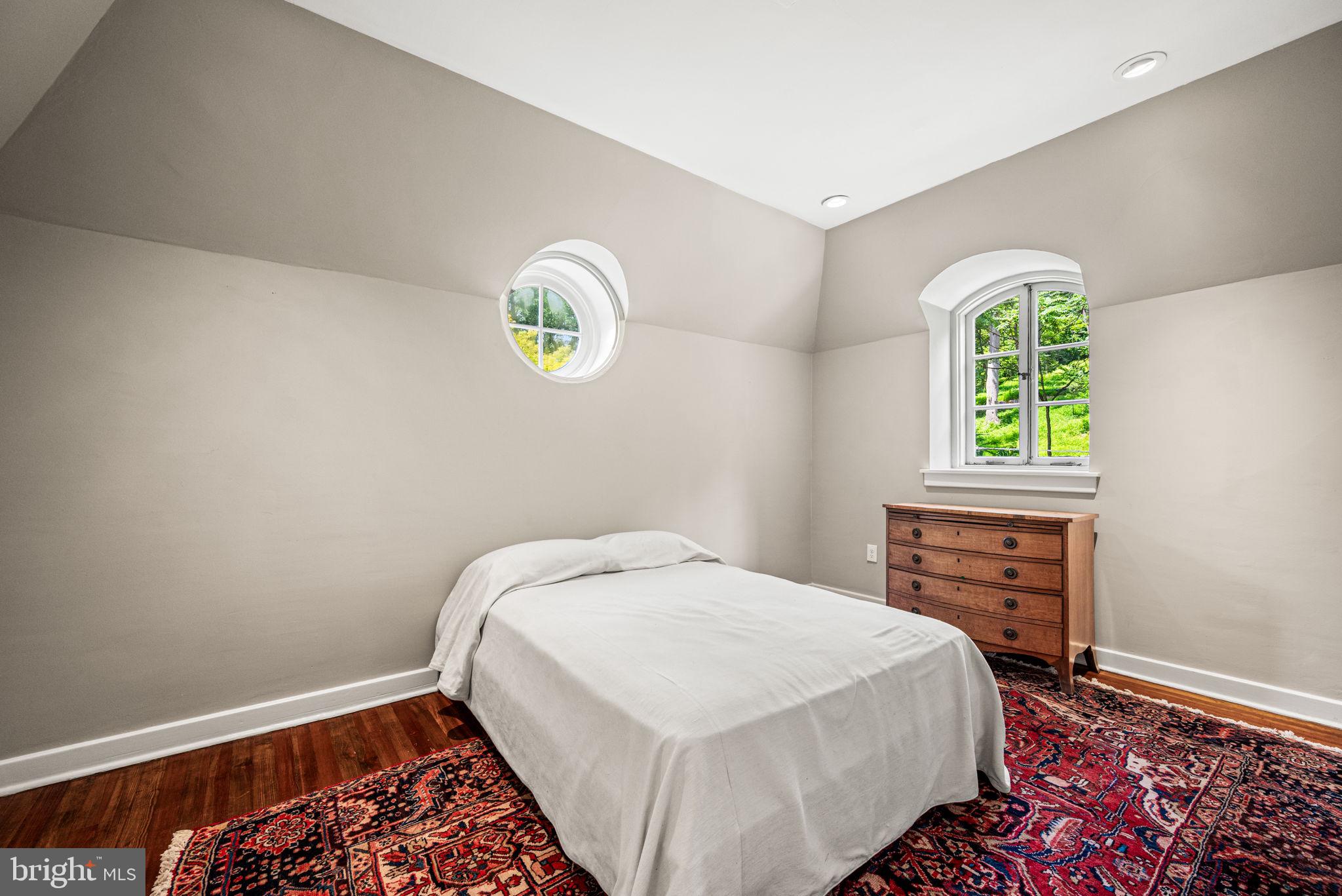 42 West Bells Mill Road Philadelphia, PA 19118 - Photo 22 of 43 a bedroom with a bed and a window