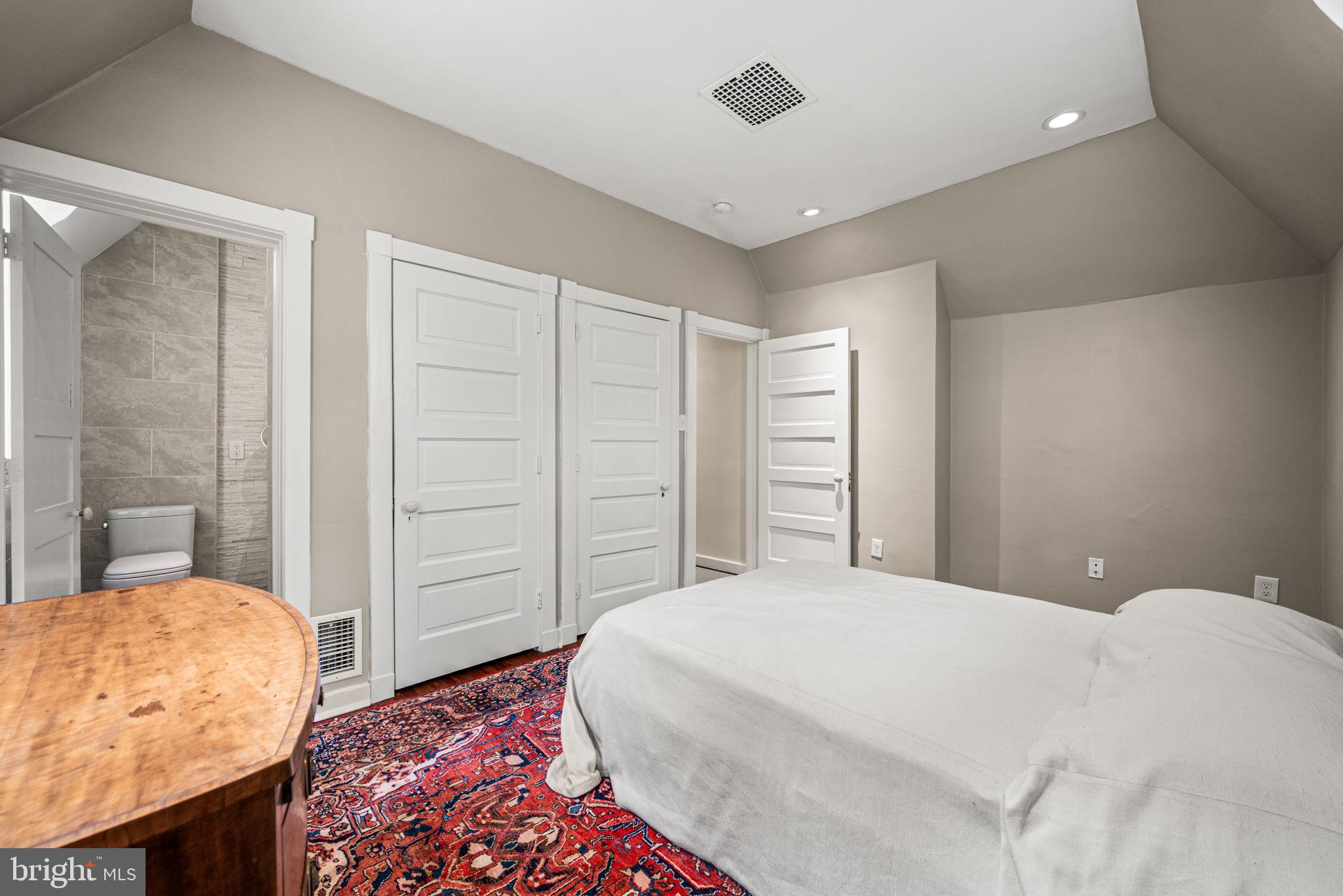 42 West Bells Mill Road Philadelphia, PA 19118 - Photo 23 of 43 a bedroom with a bed and a dresser