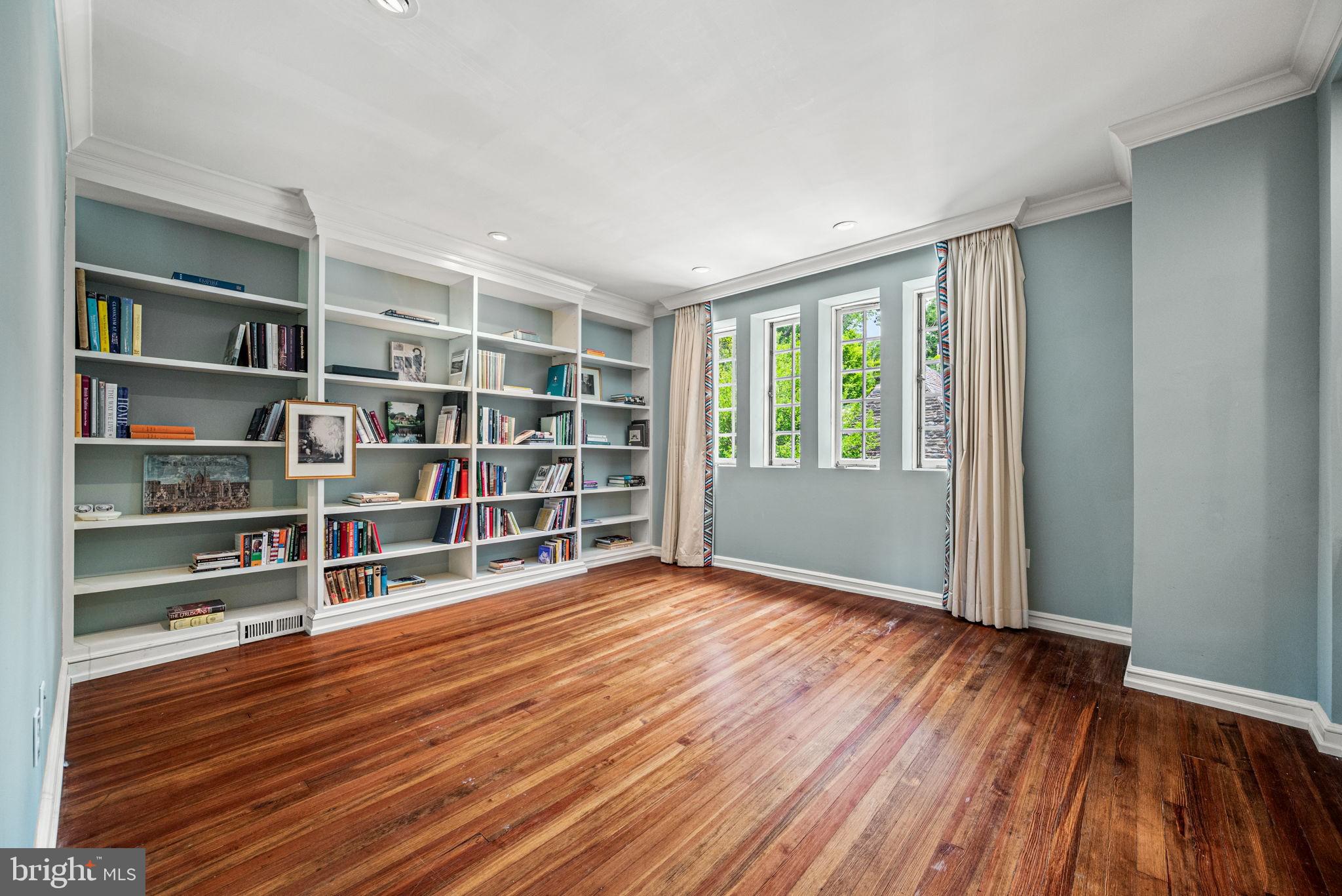 42 West Bells Mill Road Philadelphia, PA 19118 - Photo 25 of 43 a view of an empty room with a window and wooden floor