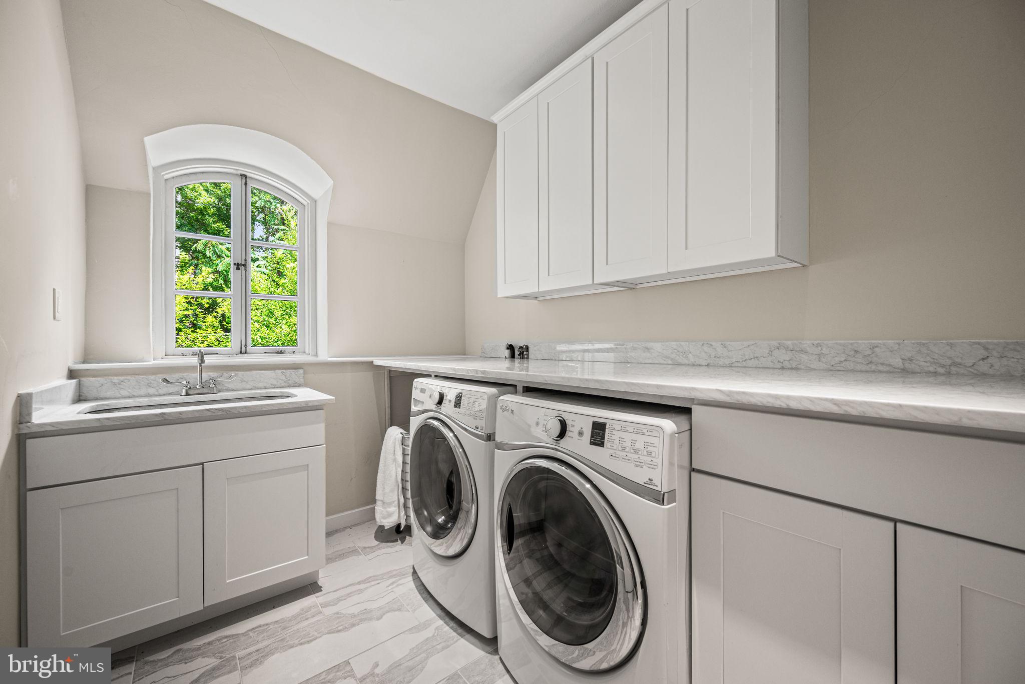 42 West Bells Mill Road Philadelphia, PA 19118 - Photo 27 of 43 a utility room with sink dryer and washer