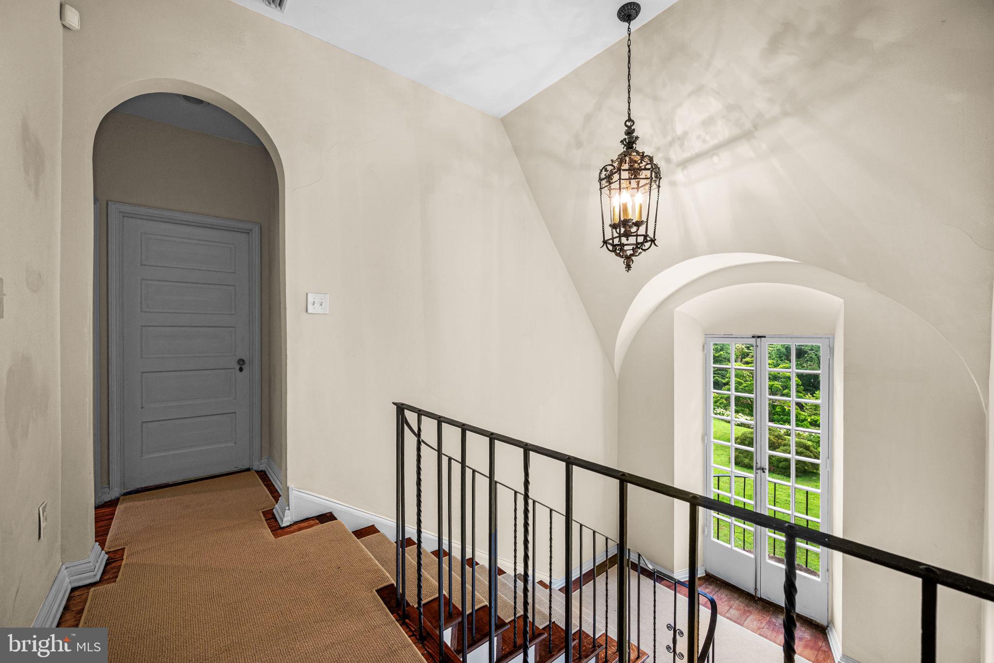 42 West Bells Mill Road Philadelphia, PA 19118 - Photo 28 of 43 a view of a hallway with windows and stairs