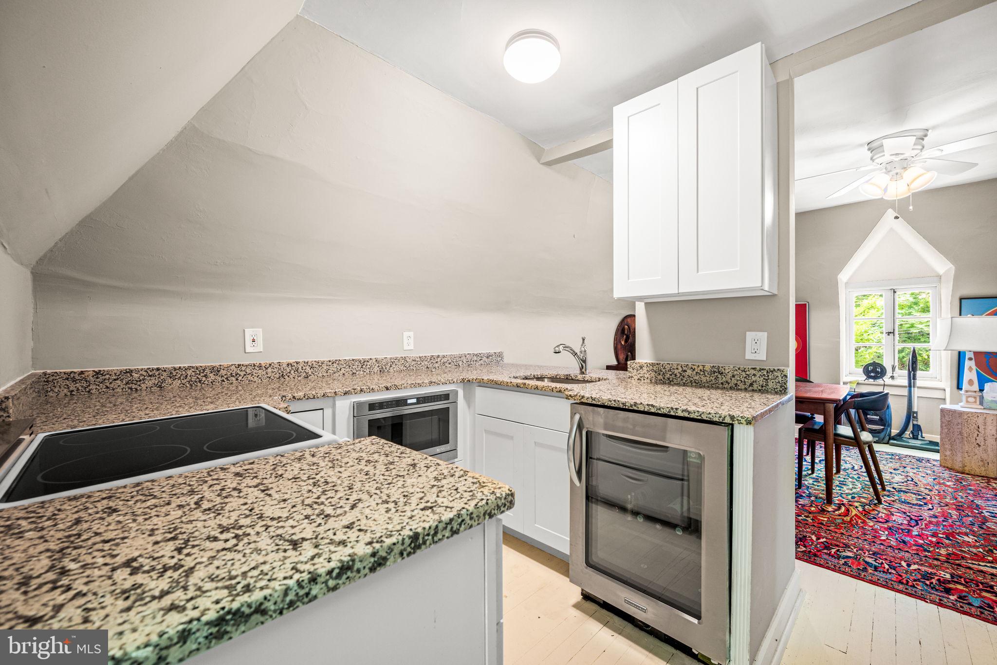 42 West Bells Mill Road Philadelphia, PA 19118 - Photo 33 of 43 a kitchen with a stove a sink and a refrigerator