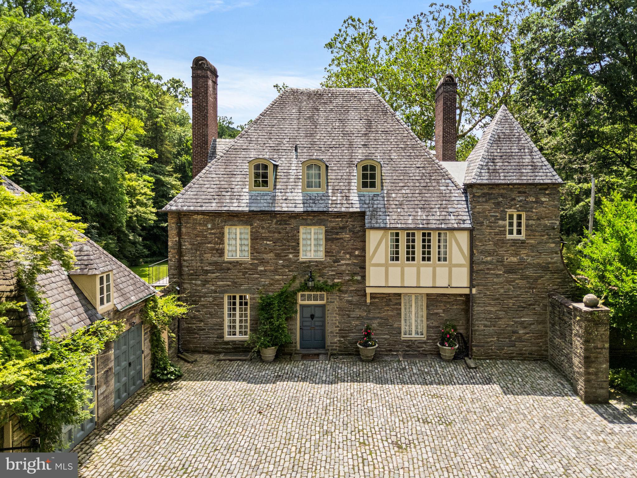 42 West Bells Mill Road Philadelphia, PA 19118 - Photo 4 of 43 a front view of a house with a yard