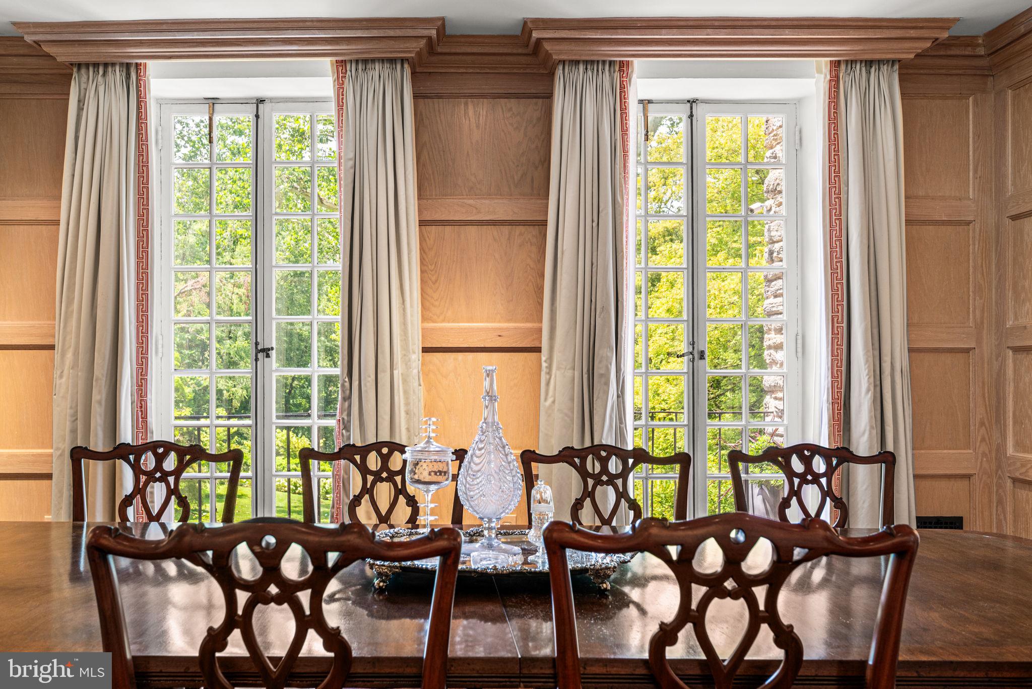 42 West Bells Mill Road Philadelphia, PA 19118 - Photo 9 of 43 a view of a dining room with furniture window and outside view
