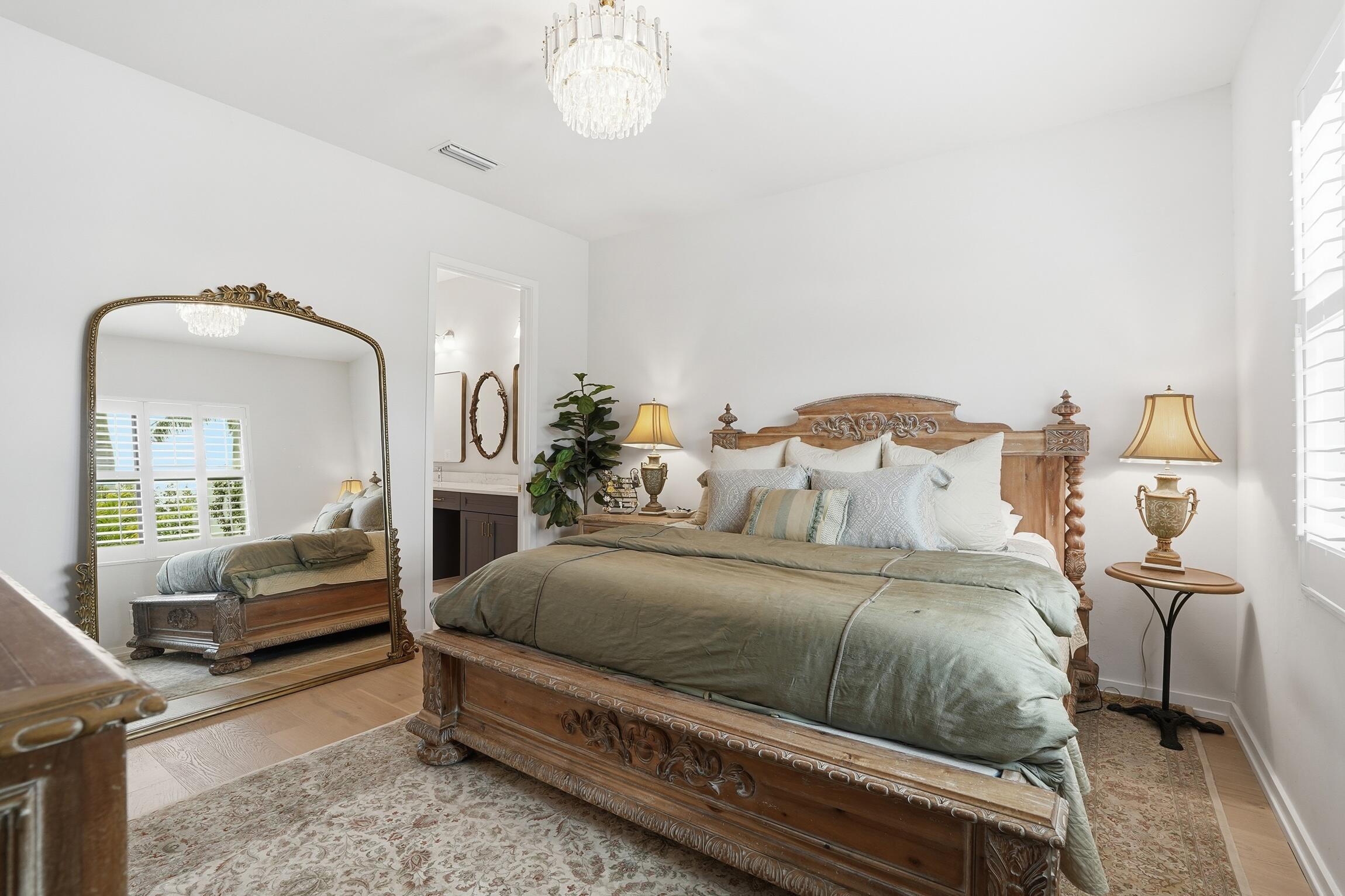 14708 Kingfisher Loop Naples, FL 34120 - Photo 20 of 42 a bedroom with a bed and wooden floor