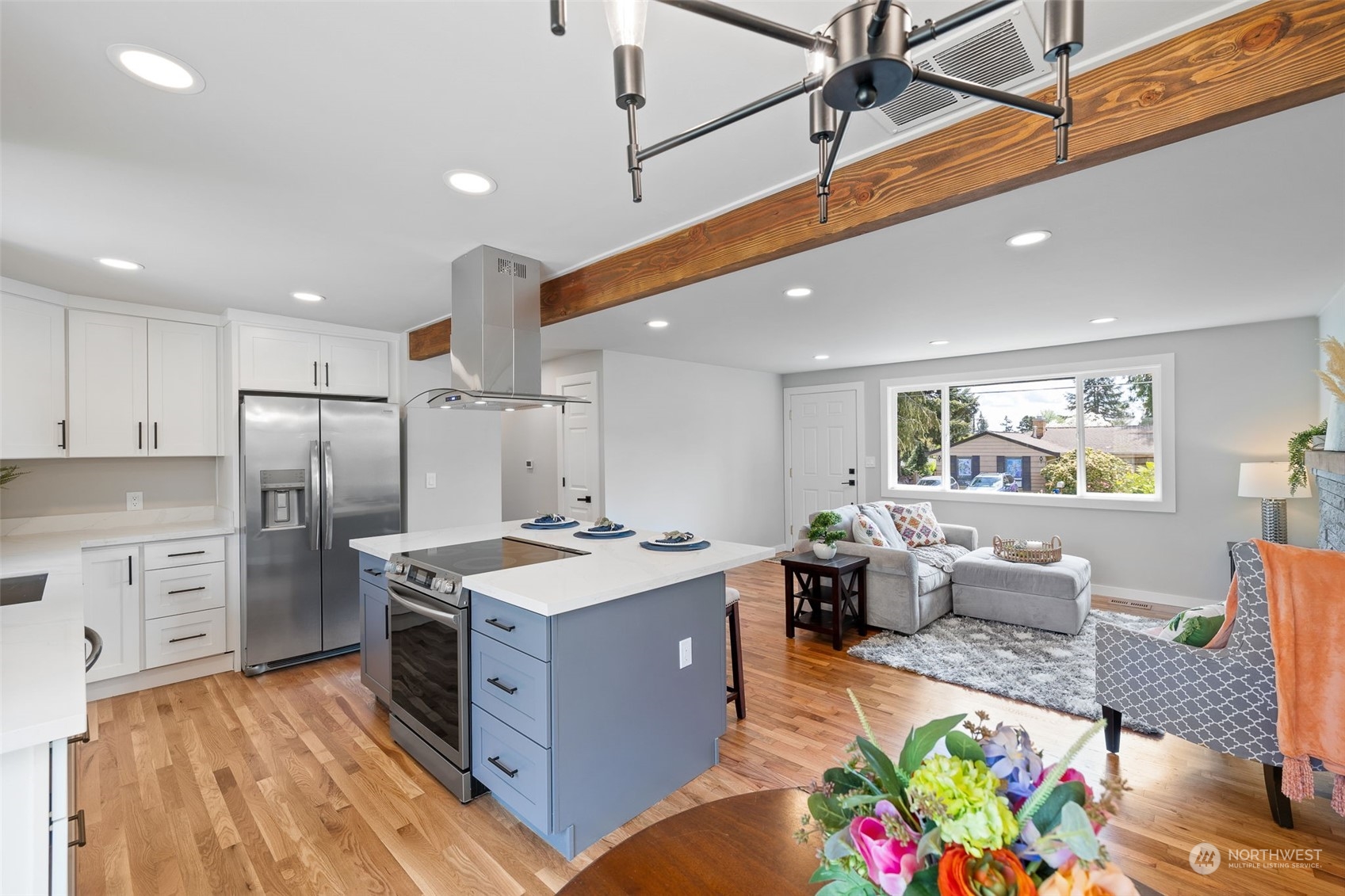 103 234th Street Southwest Bothell, WA 98021 - Photo 11 of 30 a large kitchen with stainless steel appliances granite countertop a lot of counter space and wooden floor