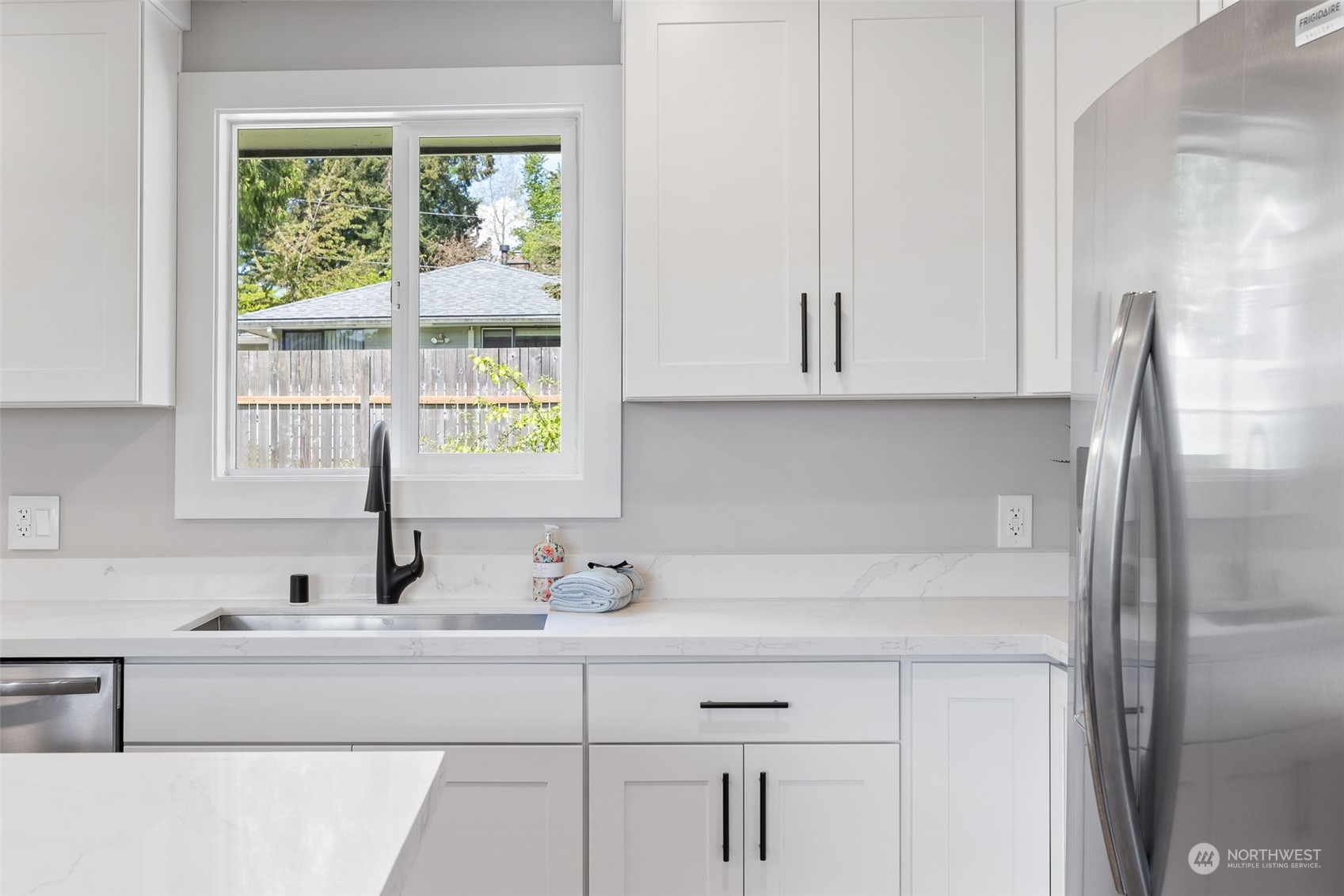 103 234th Street Southwest Bothell, WA 98021 - Photo 15 of 30 a bathroom with a sink and a window