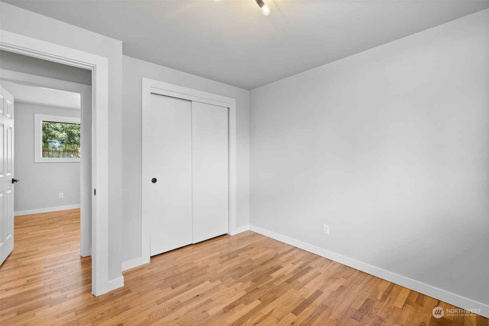 103 234th Street Southwest Bothell, WA 98021 - Photo 22 of 30 a view of empty room with wooden floor