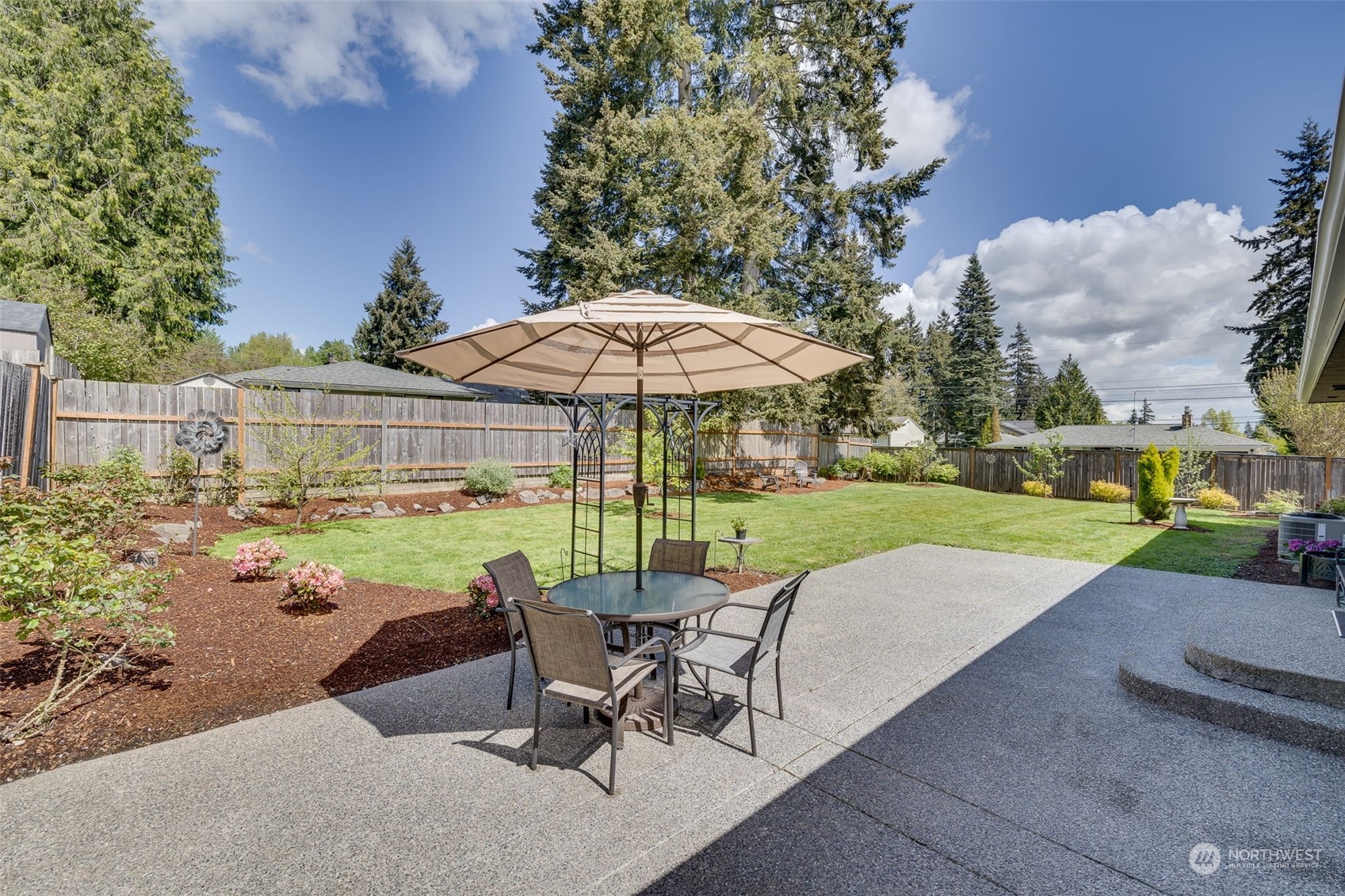 103 234th Street Southwest Bothell, WA 98021 - Photo 25 of 30 a view of a garden with furniture and garden